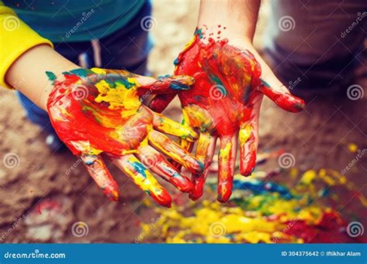 Hands immersed in the color and a heart full of people loving